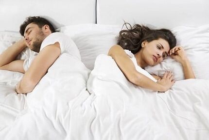 A man of weak efficiency and a frustrated woman in bed